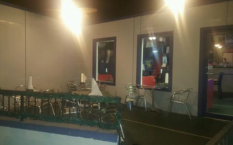 Wing Addiction balcony dining area with outdoor seating overlooking Tifton