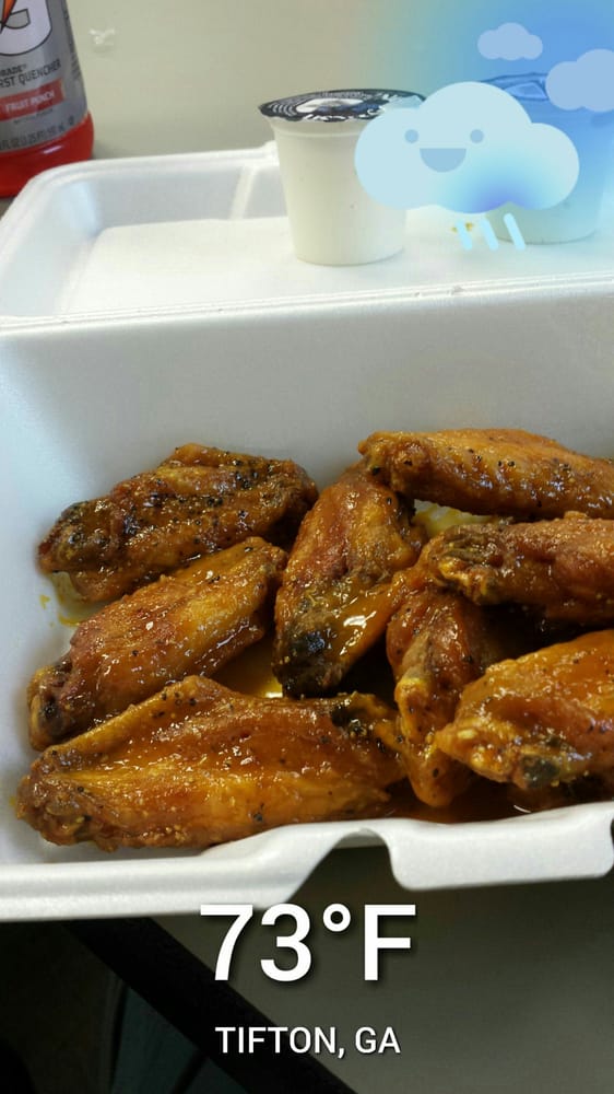 Large platter of Wing Addiction signature wings with multiple sauce options